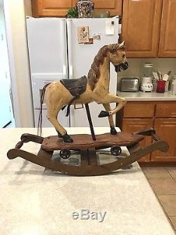 Antique / Vintage Carved Wood Rocking Horse With Leather Saddle Cast Iron Wheels
