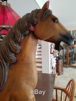 Antique Vtg rocking horse Carved Wood Leather Saddle Cast Iron Wheels Glass Eyes