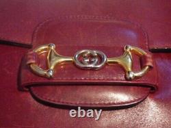 Gucci, burgundy leather, vtg 1955 Horsebit shoulder bag w gold horsebit accents