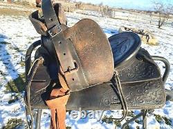 Lightly used vintage good quality US made 11 tooled pony saddle withnickel horn