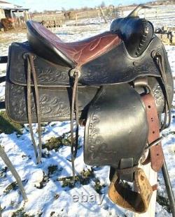 Lightly used vintage good quality US made 11 tooled pony saddle withnickel horn