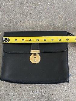 VNTG Salvatore Ferragamo black clutch / wristlet purse with horse print interior