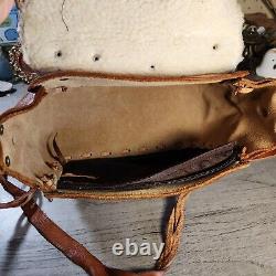 Vintage 1970s tooled leather saddle purse handmade in Mexico horse purse saddle