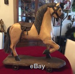 Vintage HandCarved Wood Horse On Base withIron Wheels Leather Saddle Metal Stirrup
