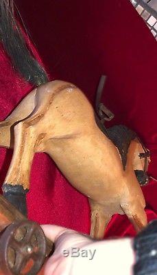 Vintage HandCarved Wood Horse On Base withIron Wheels Leather Saddle Metal Stirrup