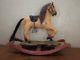 Vintage Wooden Rocking Horse Carved Leather Saddle Cast Iron Wheels Glass Eyes