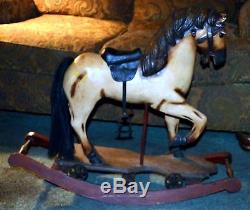 Vintage antique rocking horse, glass eyes, real horse hair tail. Leather saddle