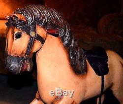 Vintage antique rocking horse, glass eyes, real horse hair tail. Leather saddle