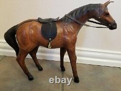 Vintage leather horse statue with saddle