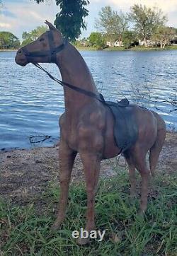 Vintage leather horse statue with saddle