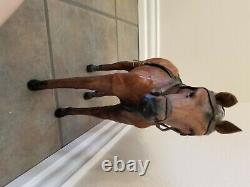 Vintage leather horse statue with saddle