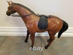 Vintage leather horse statue with saddle